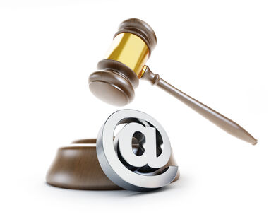 Spam is controlled in the UK and Europe An image of a gavel and an at symbol