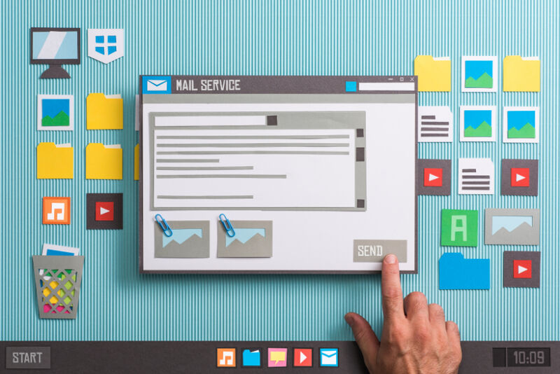 Benefits of a mailing list manager shown on a cut-out screen Paper cut-out screen showing benefits of a mailing list manager